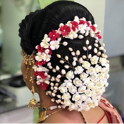artificial floral bun with vibrant flowers