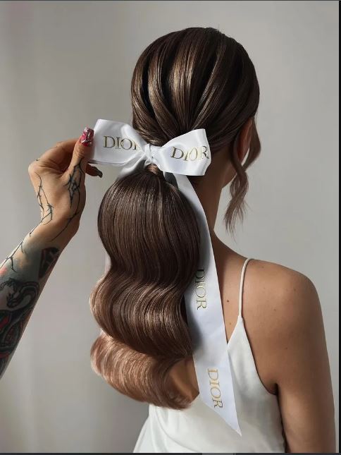 bow ponytail - wedding hair trends