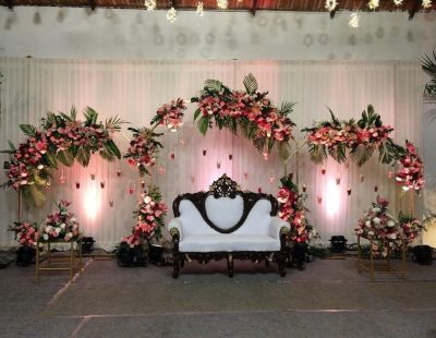 floral arches with leaves for engagement stage decoration