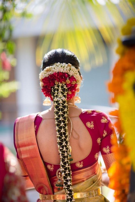 Bridal Buns Hairstyles For Indian Brides | Bridal bun, Flowers in hair,  Flower bun