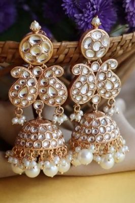 kundan heavy jewellery with fine gold and multicolored stones perfect for pastel outfits