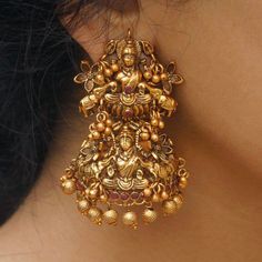 goddess lakshmi sculpture gold jhumka design with beads and pearls