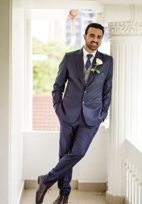 lean against the wall pose - groom poses