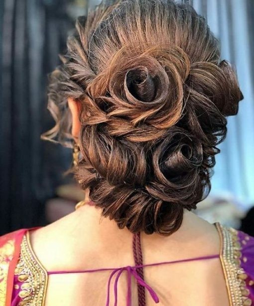 low bun with rosy twist - Engagement Hairstyles