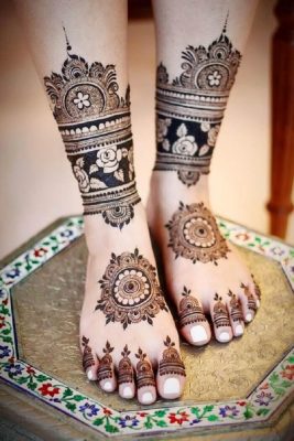 blend of mandala and rose motif mehendi design for leg for engagement