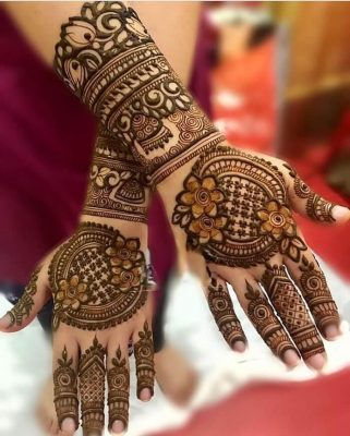 moon mehendi design with floral and other patterns for engagement
