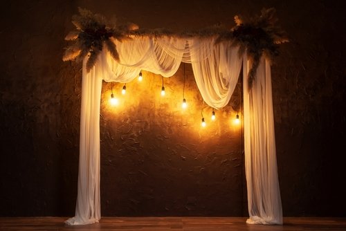 photo wall with fairy lights - home wedding decor
