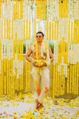 post haldi celebration shot - groom poses