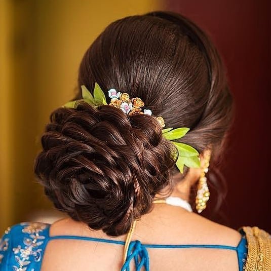 rose structured bun - wedding hair trends