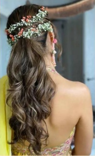 side swept curls - hairstyles for saree