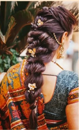 side swept fishtail - hairstyles for saree