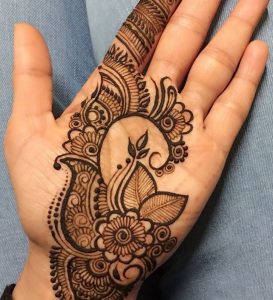 unique mehendi design with spirals and a half-heart for engagement