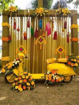 vintage photobooth with yellow scooter and tassels and dream catchers