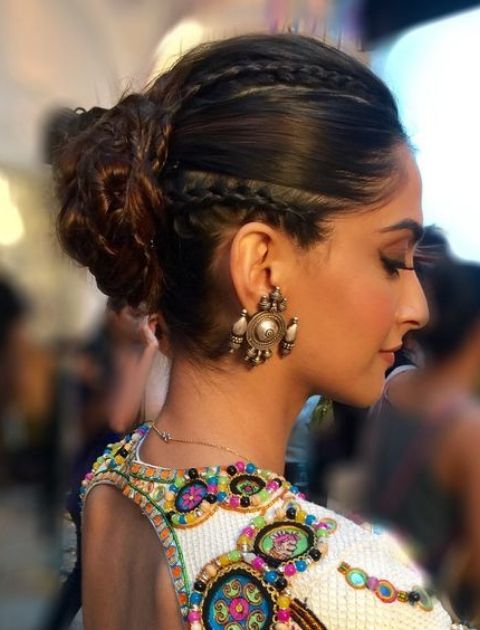 Indian girl in traditional chaniya choli for navratri with a fashionable  hairstyle poses in studio on black background Navratri is an Indian  Festival Stock Photo  Alamy