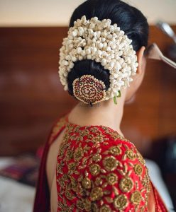 Bun Hairstyles for the Bride_flowers and broach