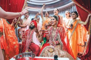 a grand indian wedding celebration with colours and laughter all around