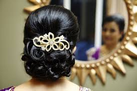 Bun Hairstyles for the Mother_curls and broach 