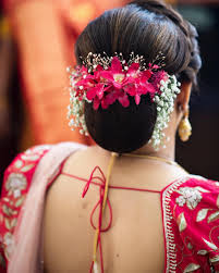 Bun Hairstyles for the Mother_low bun with flowers