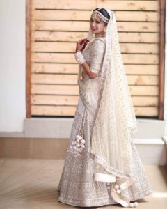 White Wedding Lehenga with White Pom Poms