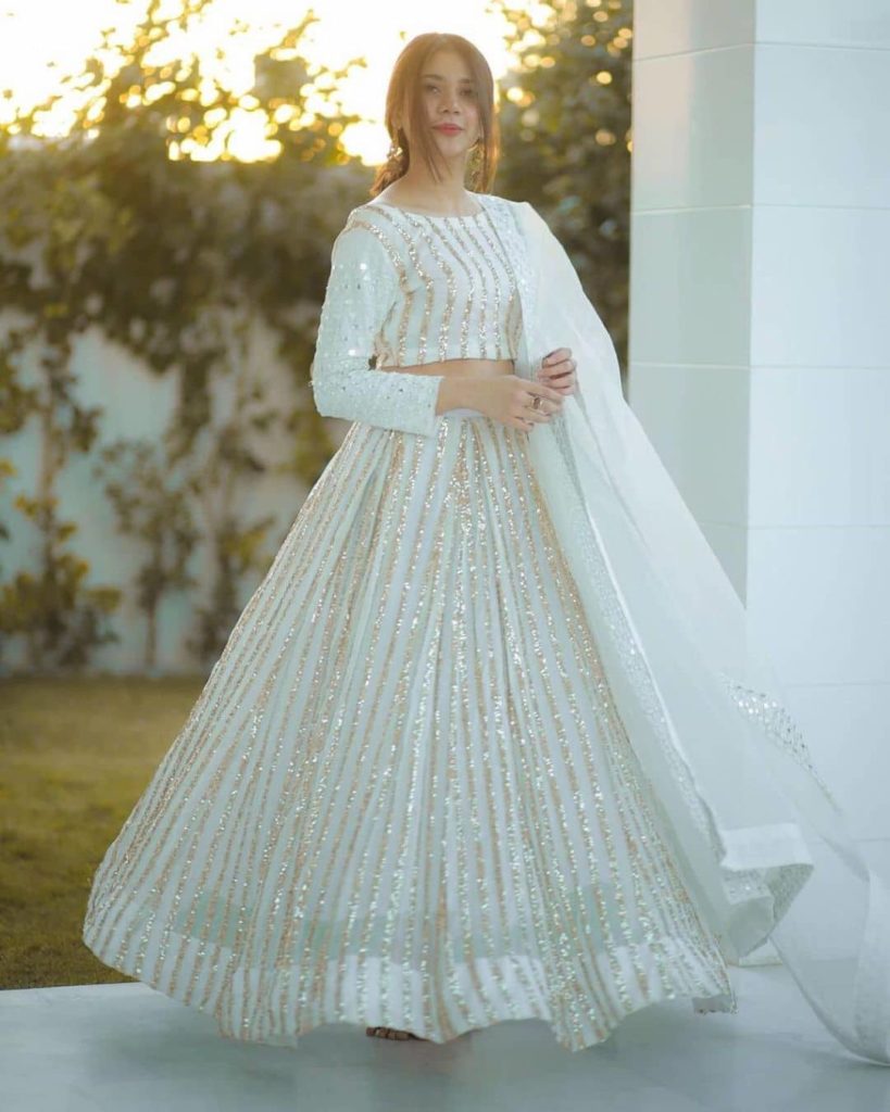 golden lines with white wedding lehenga