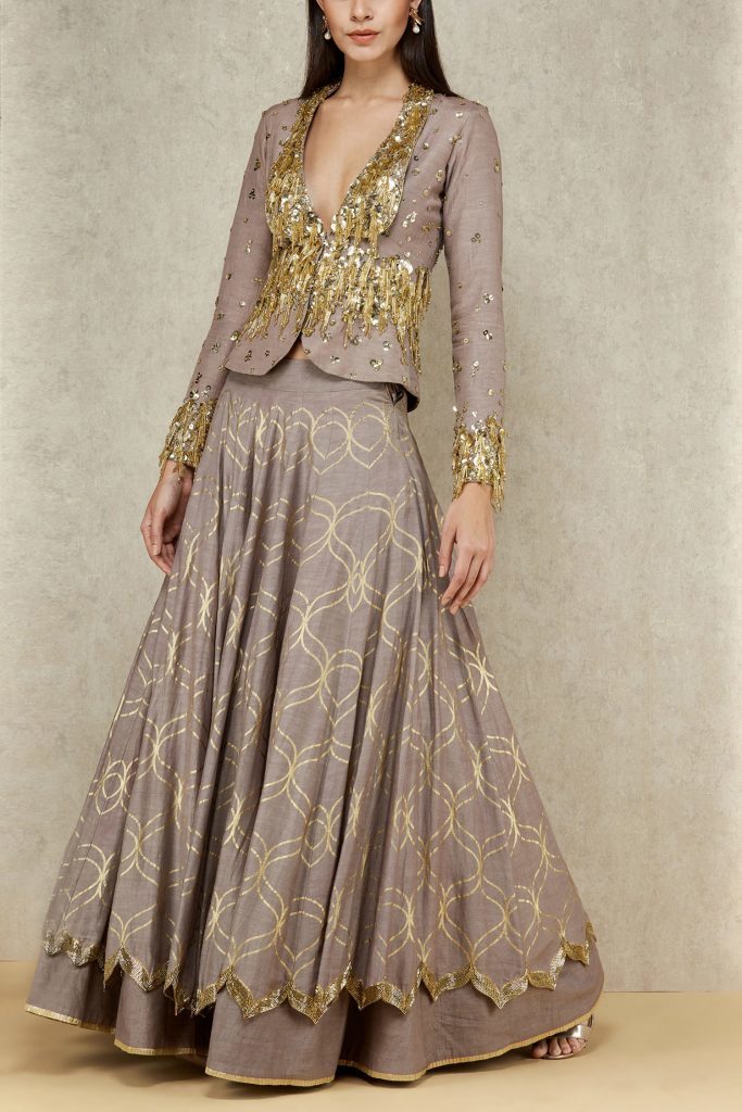 beige and gold jacket style lehenga