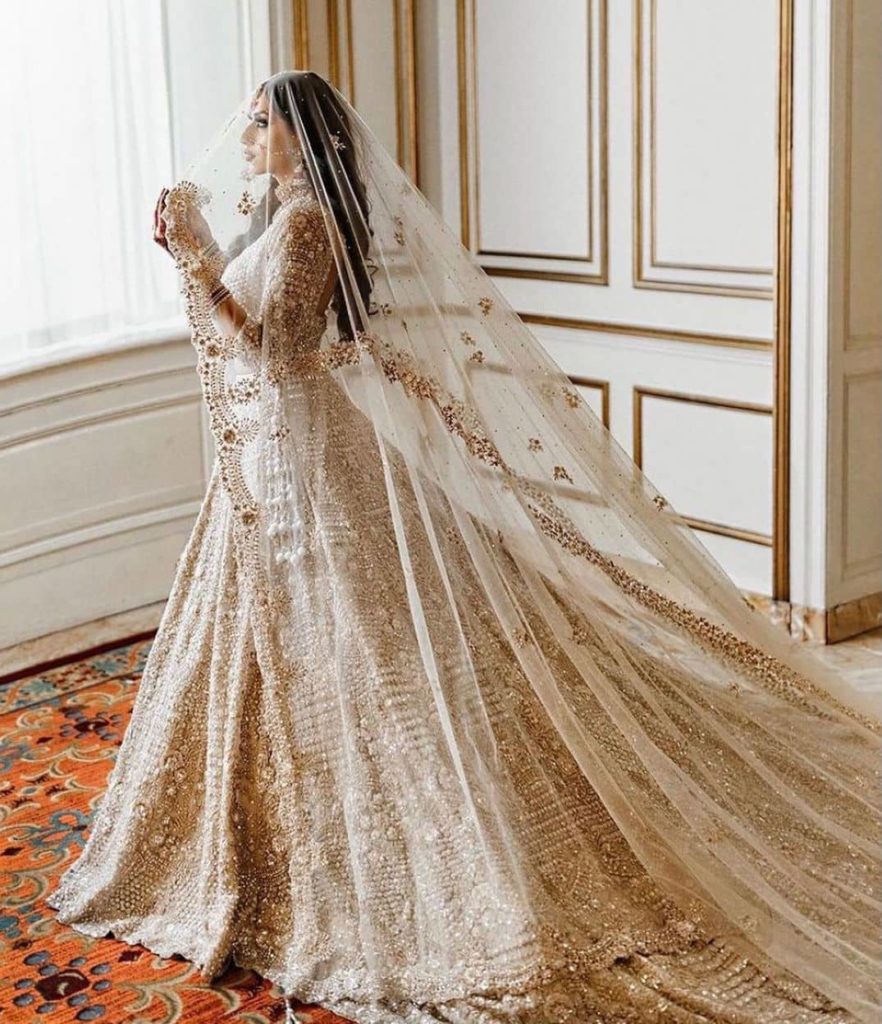 heavily embroidered white bridal lehenga