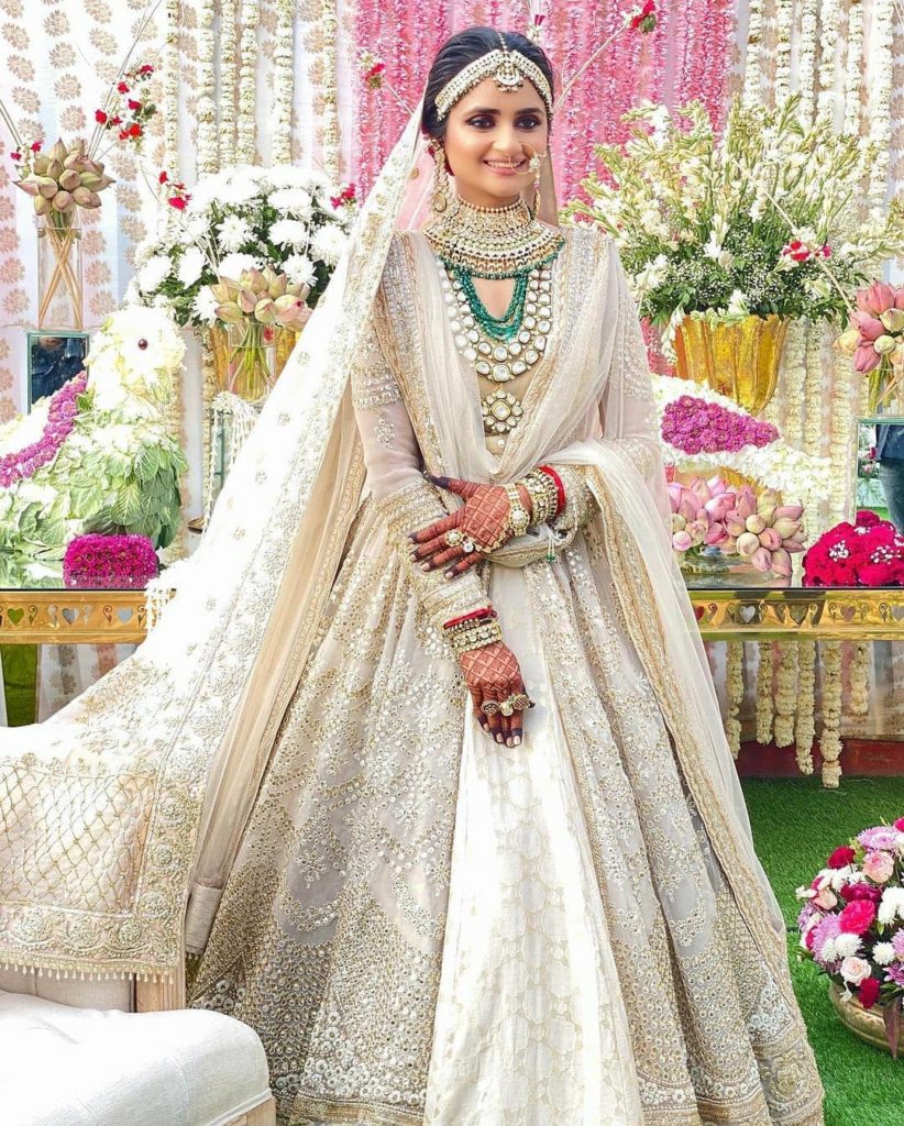 stone emroidered white bridal lehenga