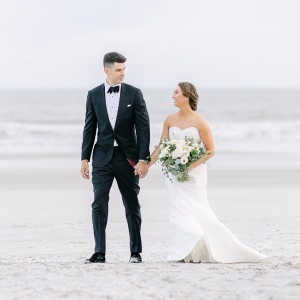 Black suits for a beach wedding groom attire