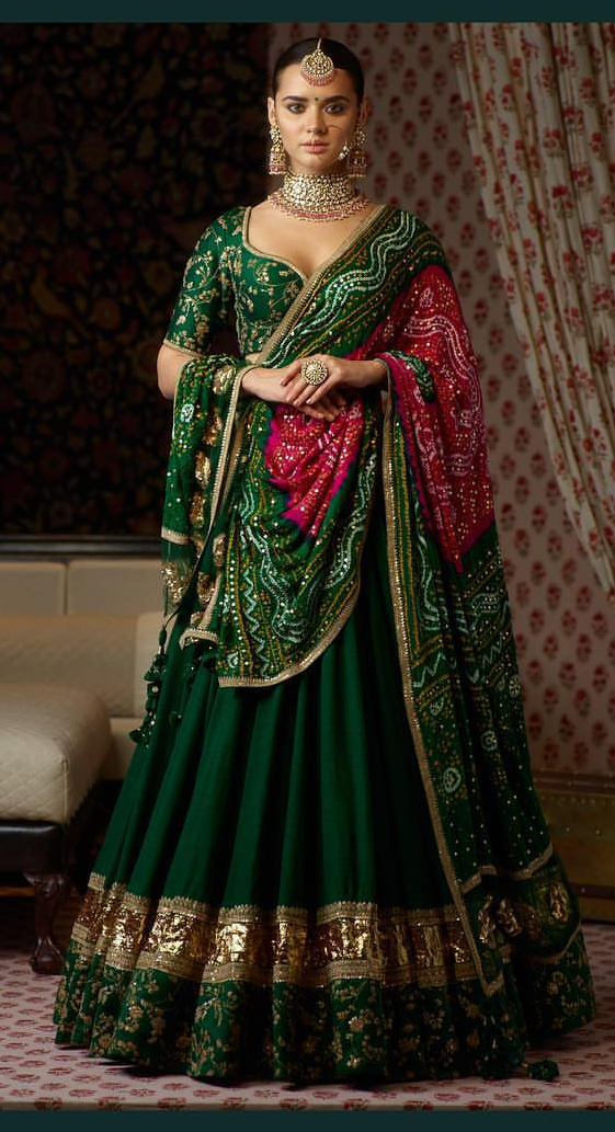 1. The Exiquiste Green Bridal Wear With Bandhani Dupatta