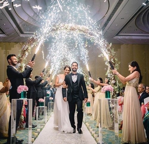 Couple having grand entry in their wedding reception