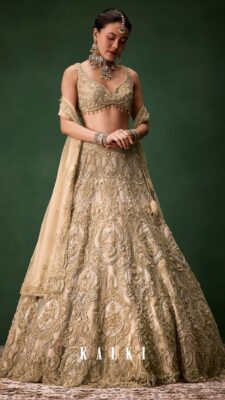 Bridal lehenga colours in champagne gold with heavy embellishments for a royal feel
