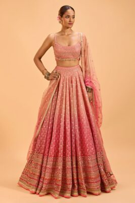 Bridal lehenga colours in pastel pink with floral detailing for a soft romantic vibe