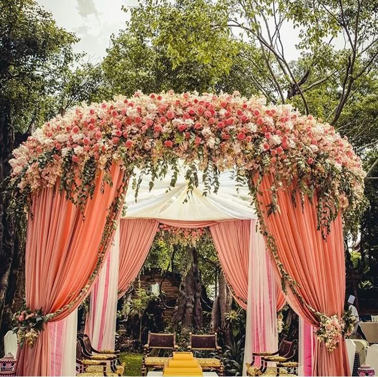 Circular Mandap Design with Peach Drapes and Flowers