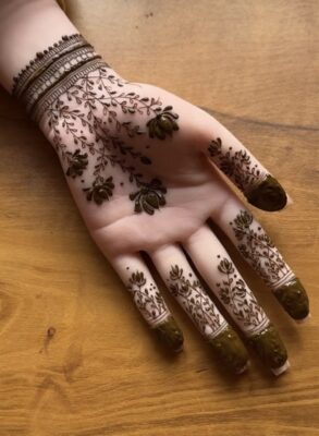 half hand mehendi design with bold negative space concept