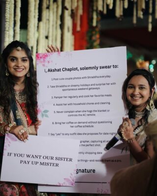Indian wedding ritual of entrance blocking by bridesmaids for shagun