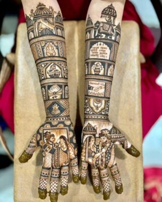 Bride posing with detailed mehendi featuring couple motifs