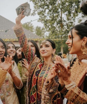 Indian wedding ritual with family exchanging money during ceremony