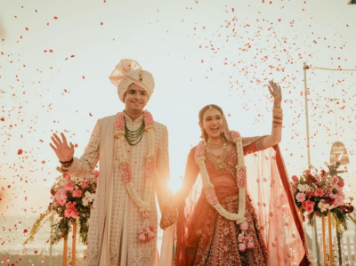 Bride and groom entry planned by wedding event management companies with coordinated decor and lighting