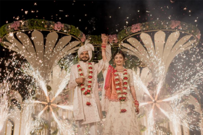 Elegant Indian wedding setup designed by top wedding event management companies with floral decor and stage lighting